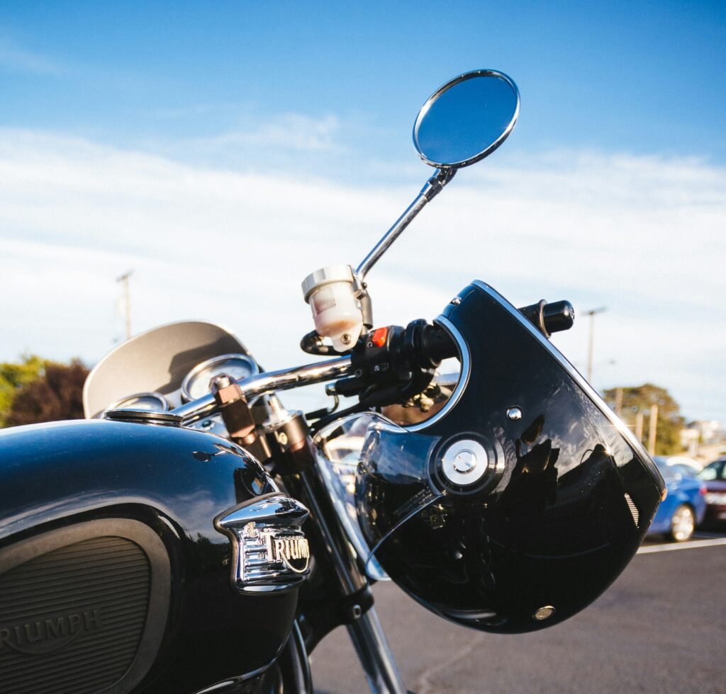 The Ultimate Guide to Motorcycle Helmets - helmet on handlebar